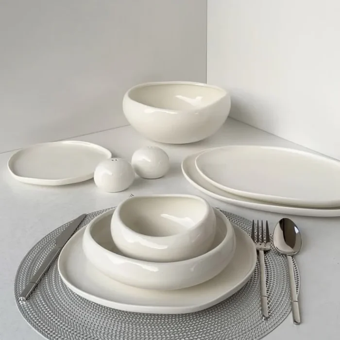White Ceramic Dinnerware Set on Placemat